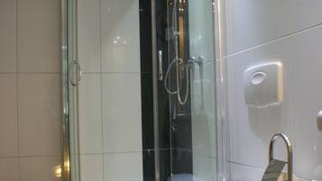 Shower, free toiletries, hair dryer, slippers