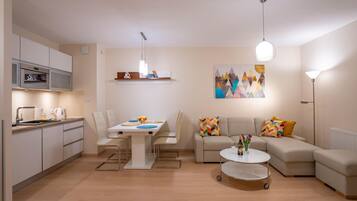 Superior Apartment | Living area | Flat-screen TV