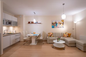 Superior Apartment | Living area | Flat-screen TV