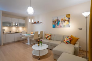 Superior Apartment | Living area | Flat-screen TV