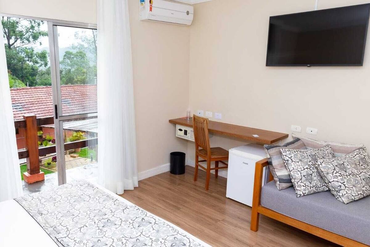 Deluxe Room, Patio | Minibar, in-room safe, laptop workspace, blackout drapes