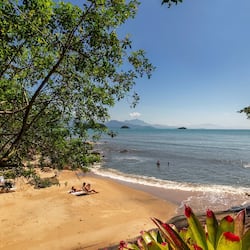 On the beach, white sand, sun-loungers, beach umbrellas