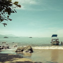 On the beach, white sand, sun-loungers, beach umbrellas