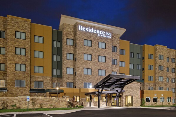 Welcome to Residence Inn, a modern hotel with a covered entrance and inviting atmosphere.