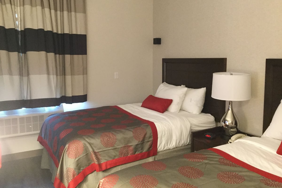 Premium bedding, memory foam beds, desk, laptop workspace