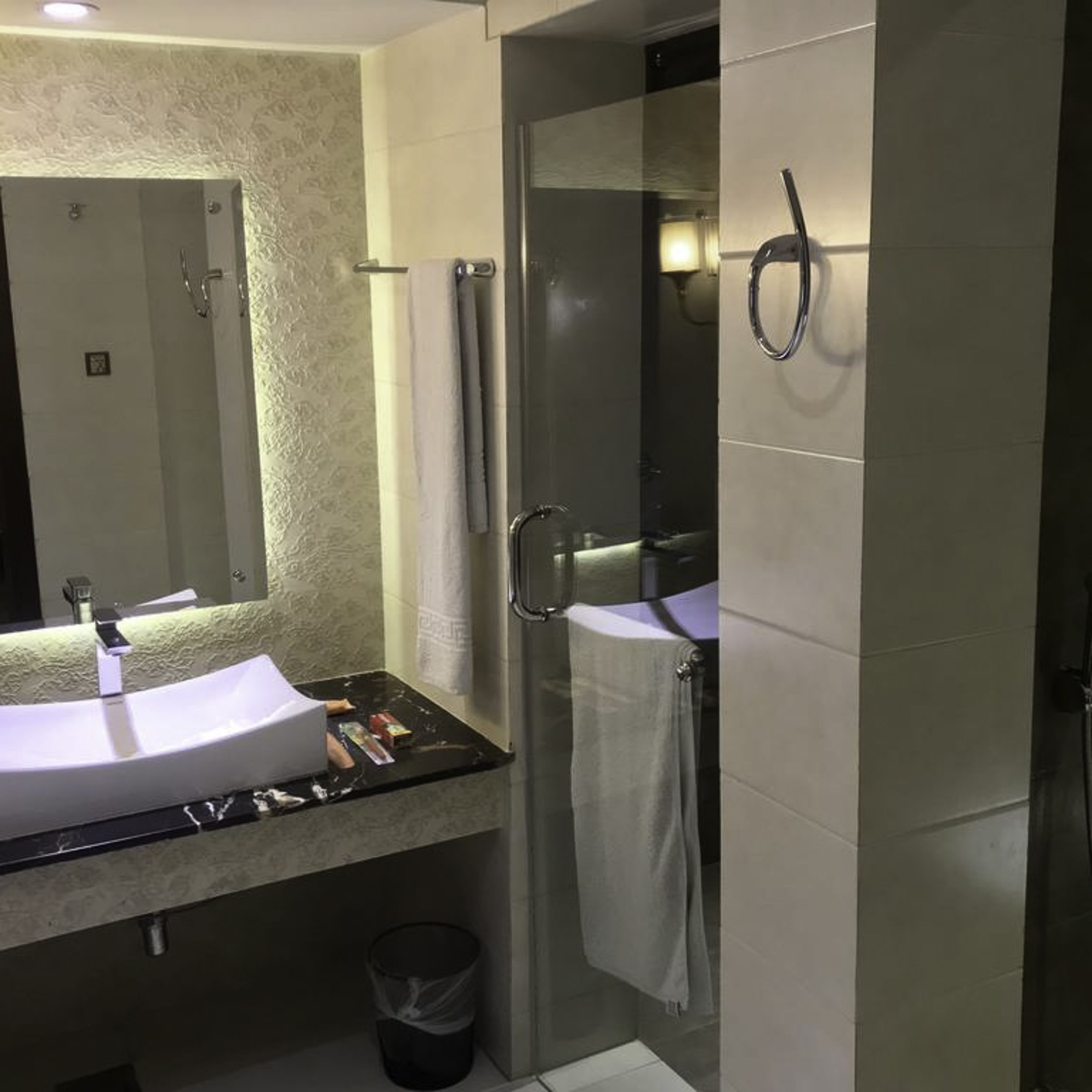 shower, free toiletries, slippers, towels