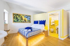 Suite Deluxe, 1 cama Queen size y sofá cama, para no fumadores | Sábanas de algodón egipcio y ropa de cama de alta calidad