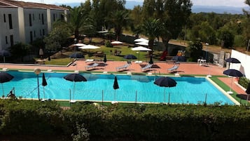 Outdoor pool, open 9 AM to 7:30 PM, pool loungers