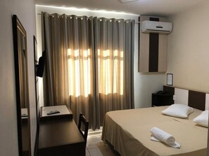 Minibar, desk, blackout curtains, iron/ironing board