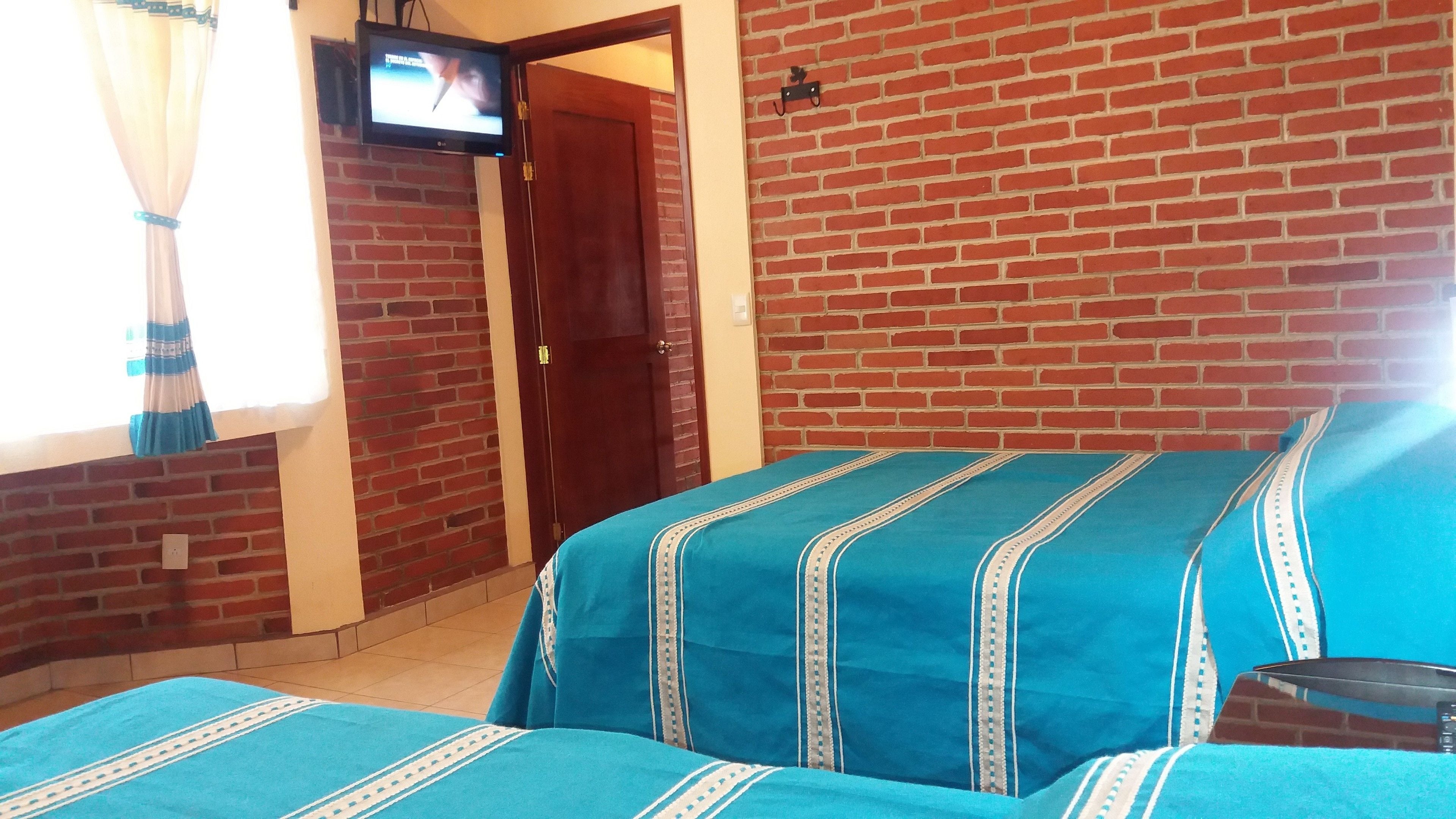 family room, 2 double beds | blackout curtains, free wifi, bed sheets