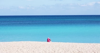 At the heart of Ocean Village. Private beach, gym, tennis, golf, pools, etc...