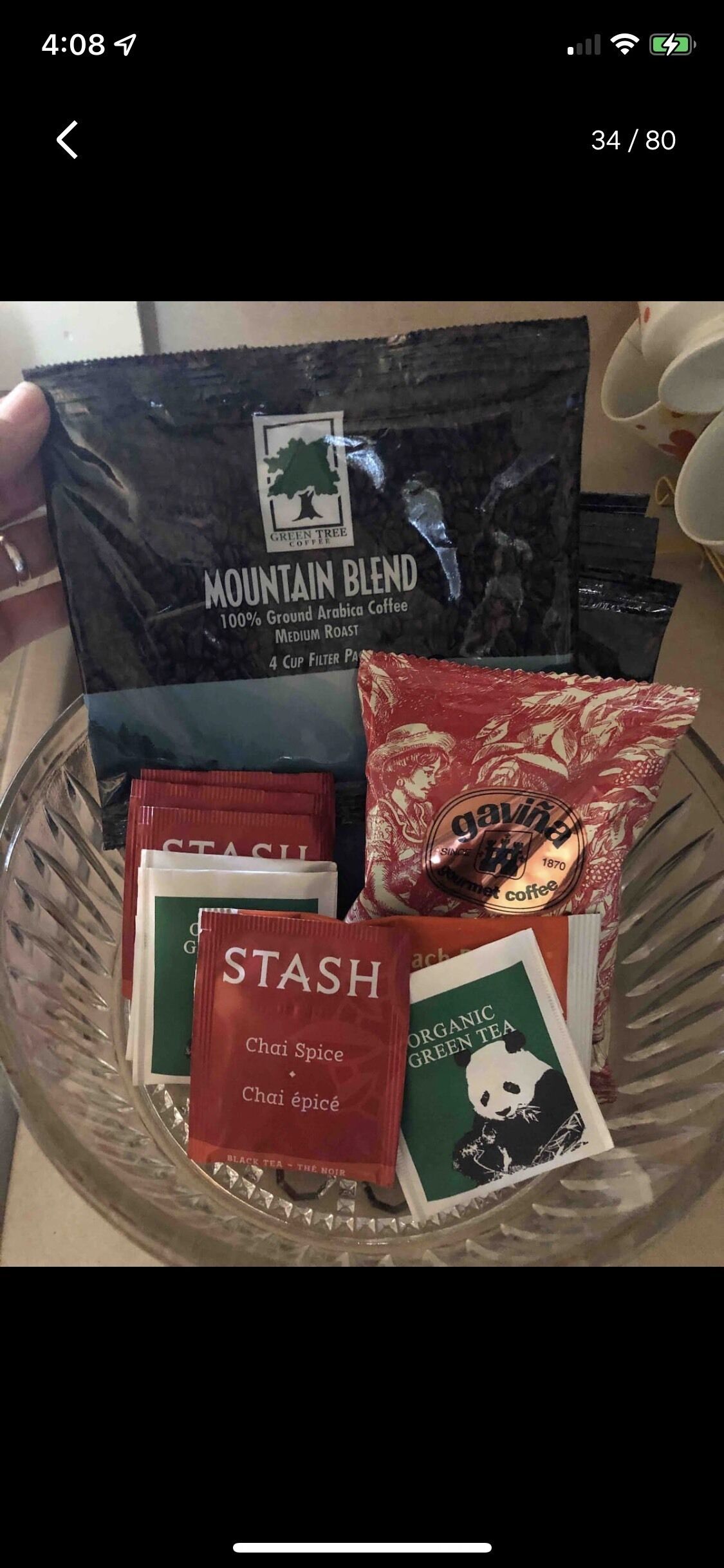 A glass bowl containing various coffee packets and a bag labeled "Mountain Blend."