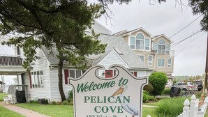 A welcome sign for Pelican Cove at 103 Vista Road, Units 1-7, with a private property no trespassing sign. - Middle of Dewey ,On the Bay, Close to the Beach  (Dewey Beach)