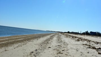 On the beach, sun loungers, beach towels