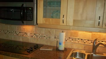 Fridge, microwave, stovetop, coffee/tea maker