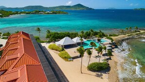 A resort with a long building, a swimming pool, and a beach. - BEST VALUE! New reno, Beach 10' from door, water 50' away WE MOVED ID 5216594 !! (Red Hook)