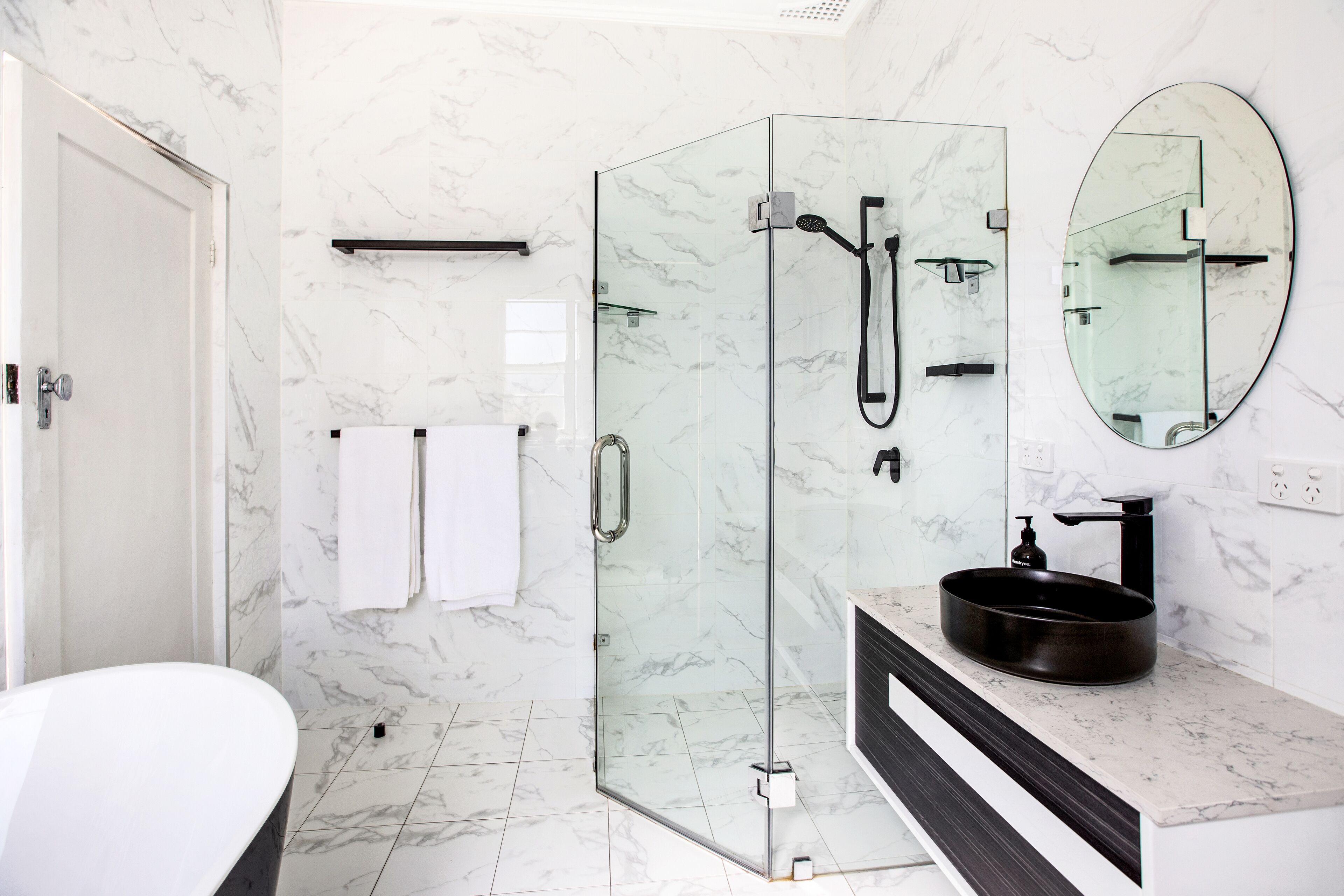 Combined shower/bathtub, hair dryer, towels, soap