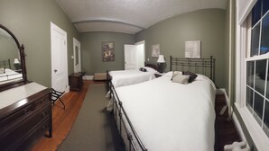 A hotel room with two beds, a dresser, a mirror, and a window. - Spacious Condo In Cranston/Providence Line - 2 Bed (Cranston)