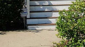 A two-story house with a front porch, numbered 138 and 140, and a potted plant on the steps. - Spacious Condo In Cranston/Providence Line - 2 Bed (Cranston)