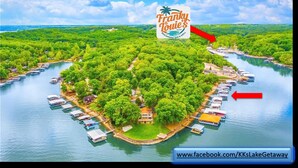 An aerial view of a lakeside property with a beachfront bar and grill, surrounded by lush greenery and docked boats. - 10MM Lake Getaway - 3 Br, 2 Bath - Franky & Louie's Cove! (Sunrise Beach)
