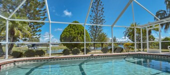 LUXURY WATERFRONT! WARM PRIVATE POOL! MIN TO BEACHES! WIFI! GRILL! BABY SUPPLIES