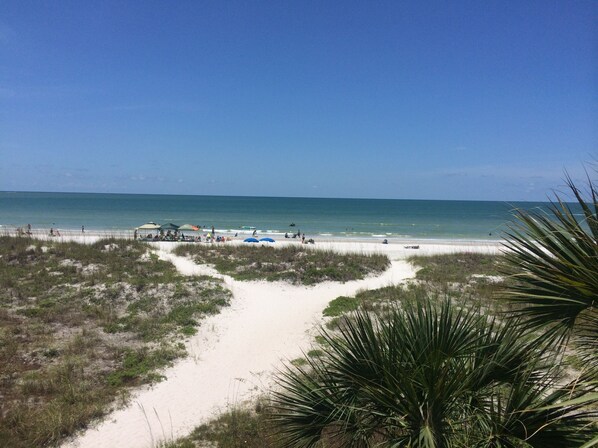 On the beach, sun-loungers