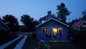 A house with a patio, a chimney, and a satellite dish. - Slow down…You’re on Island Time (Isle La Motte)