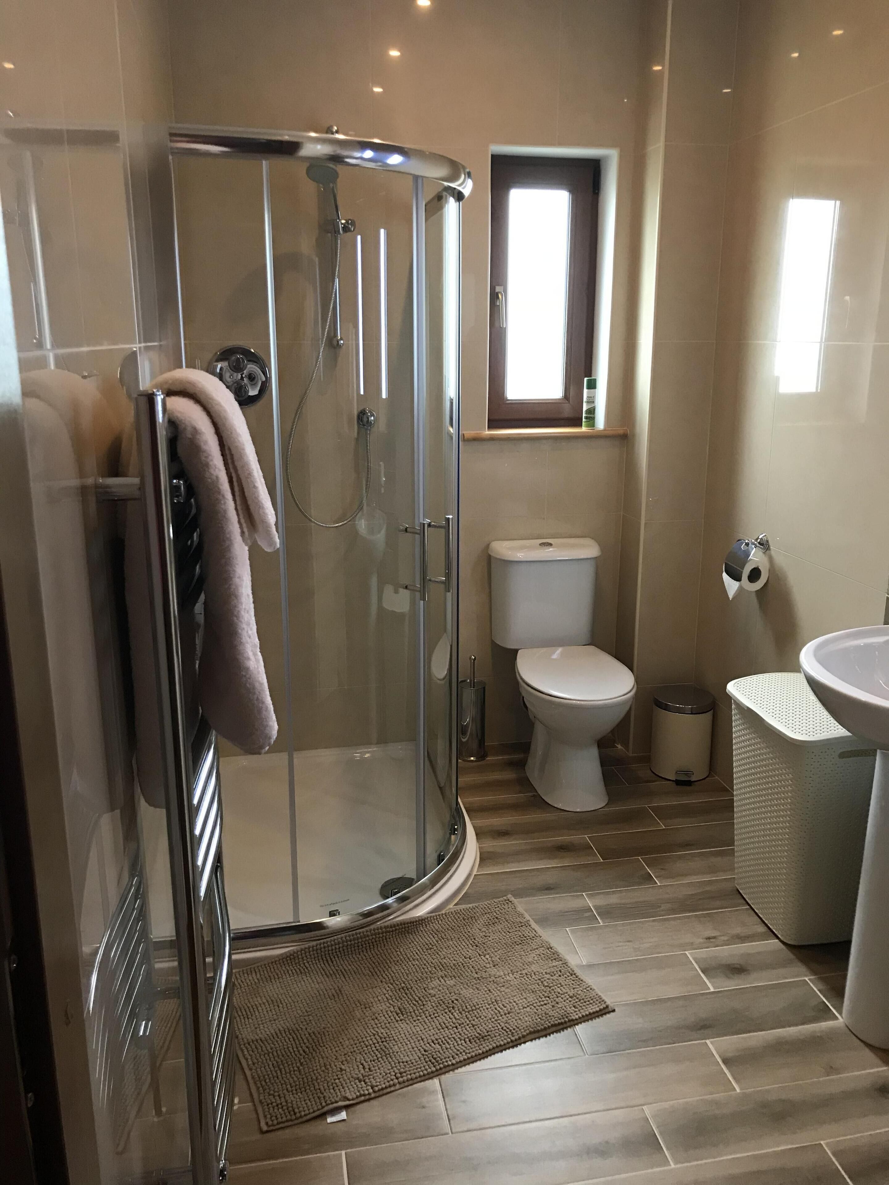 Shower, eco-friendly toiletries, hair dryer, towels