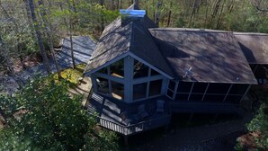 A house with a large deck, a covered porch, and a satellite dish. - Perfect for Large Groups • Hot Tub • Fire Pit • Fast Wi-Fi & Sparkling Clean (Pisgah Forest)