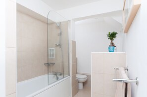 Combined shower/tub, hair dryer, towels, soap