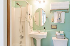 Combined shower/bathtub, hair dryer, towels, soap