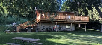 A wonderful, secluded 2 story cabin, deck, fire pit, stocked pond for fishing.  