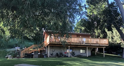 A wonderful, secluded 2 story cabin, deck, fire pit, stocked pond for fishing.