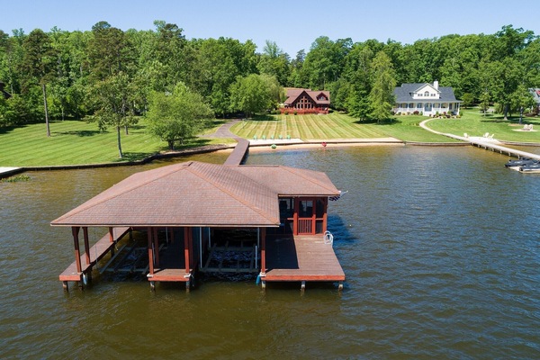 Our boat house with our home in the background as seen from above the lake