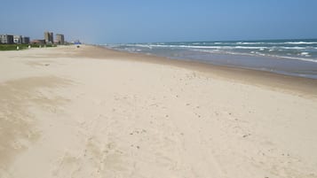 On the beach, sun-loungers, beach umbrellas, beach towels