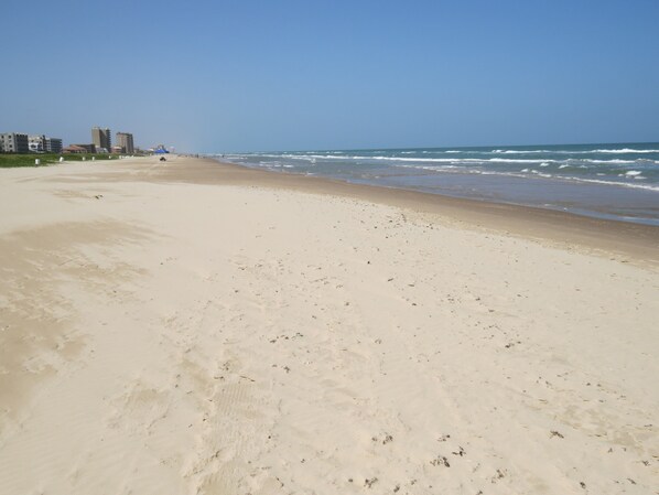 On the beach, sun-loungers, beach umbrellas, beach towels