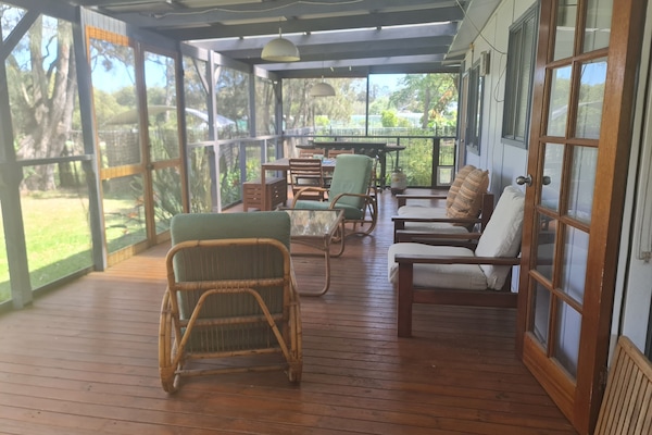 Huge screened deck, overlooking Curley's Bay (the river)