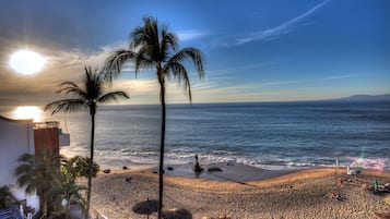 On the beach, sun loungers, beach towels