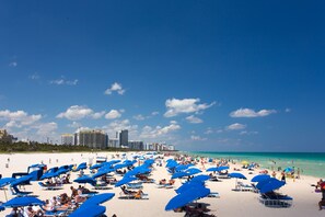 On the beach, sun-loungers, beach towels