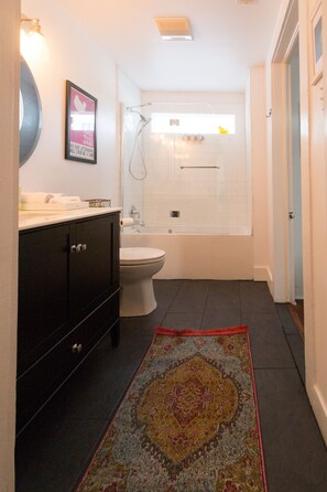 Combined shower/tub, hair dryer, towels, soap