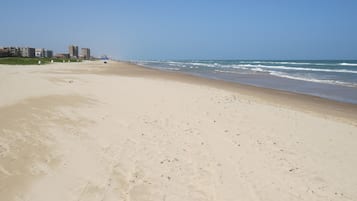 On the beach, sun-loungers, beach umbrellas, beach towels