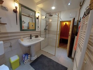 Bathtub, hair dryer, towels, soap