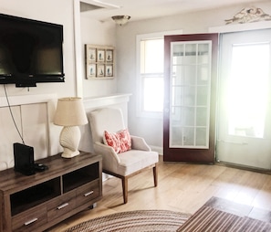 Flat-screen TV, DVD player, books