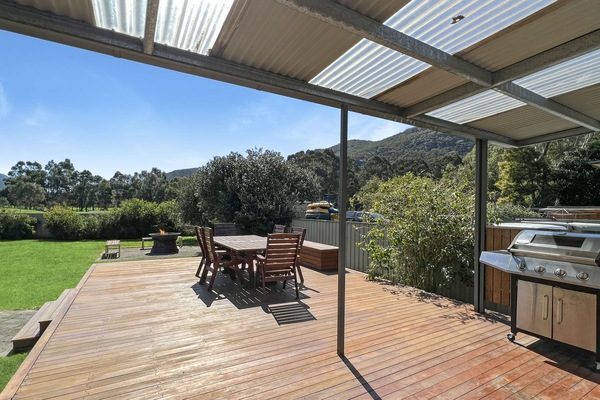 Back deck delight: BBQ, scenic backdrop. Outdoor dining and lasting memories await.