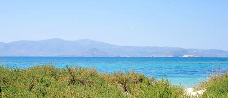 On the beach, sun-loungers, beach towels