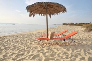 On the beach, sun-loungers, beach towels