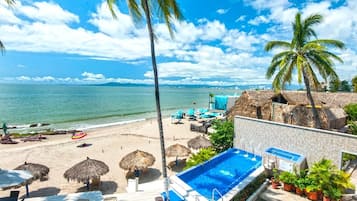 On the beach, sun-loungers, beach towels