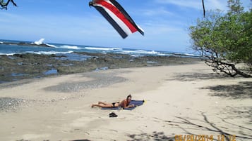 On the beach, sun loungers, beach towels