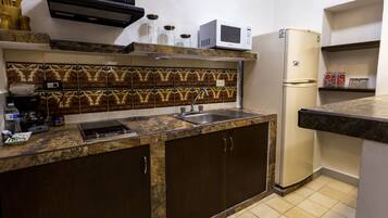 Fridge, microwave, stovetop, coffee/tea maker