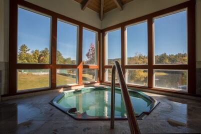 Resort home with Private hot tub , fireplace, pools, pond, WIFI